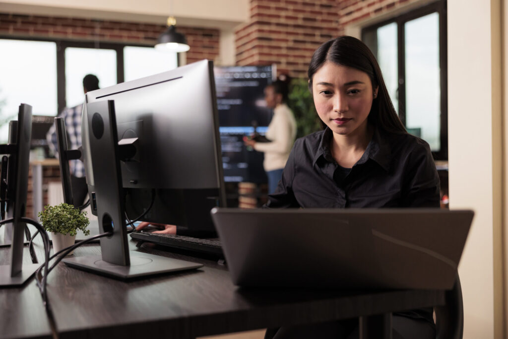 Developer working on server code in a modern office